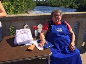 Alice Duston, Head Race Judge registers competitors. 