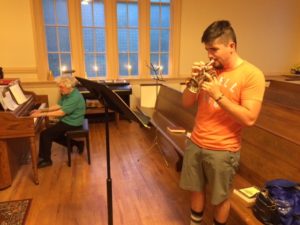 Stowe Duston practices with Marg Small on the French Pocket Trumpet for Sunday morning's music.